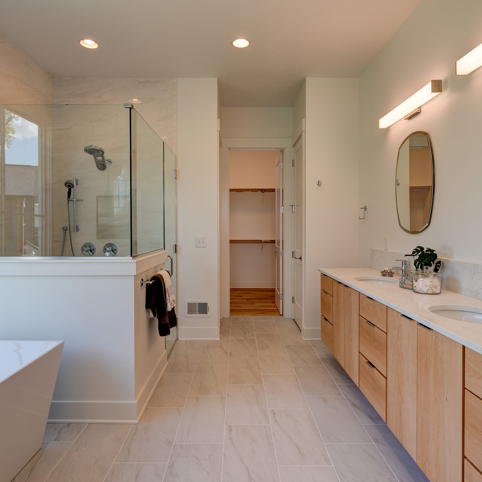 A bathroom with a sink, tub and shower.