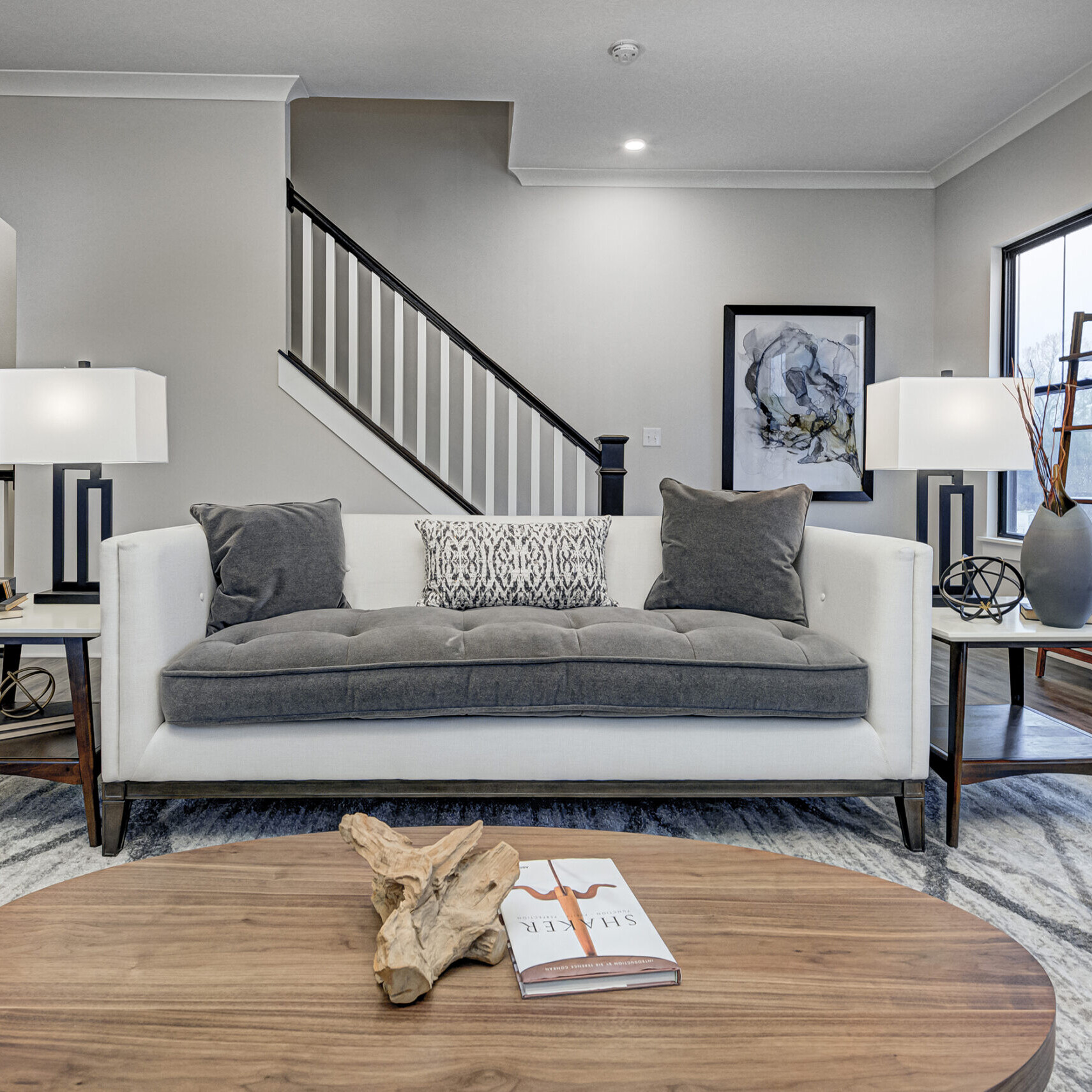 A living room with a couch and a coffee table in a custom home in Indianapolis.