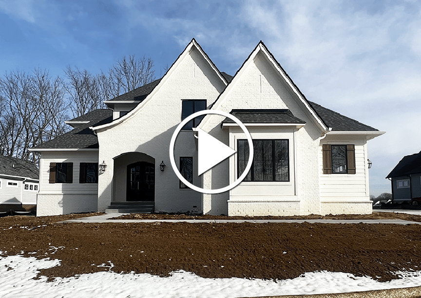 A custom white house with snow on the ground, perfect for virtual tours.